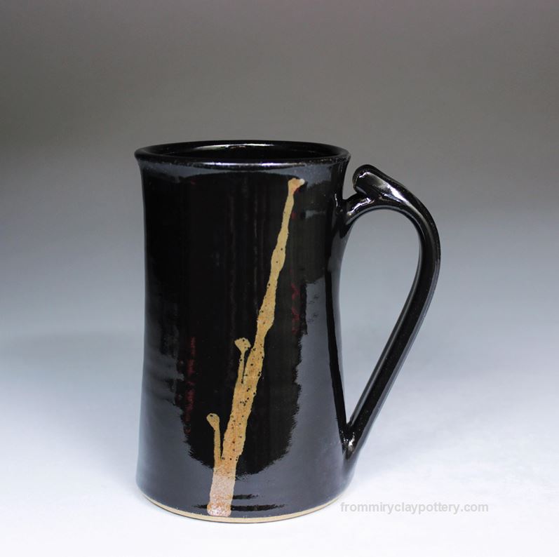 https://www.frommiryclaypottery.com/uploads/6/2/5/2/62525325/black-with-bronze-tall-slender-mug-06-handmade-pottery-1_orig.jpg